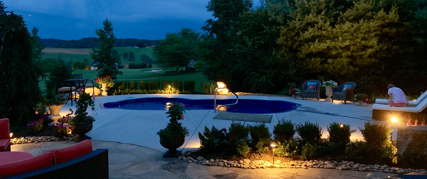 A view of the pool with trees in the background